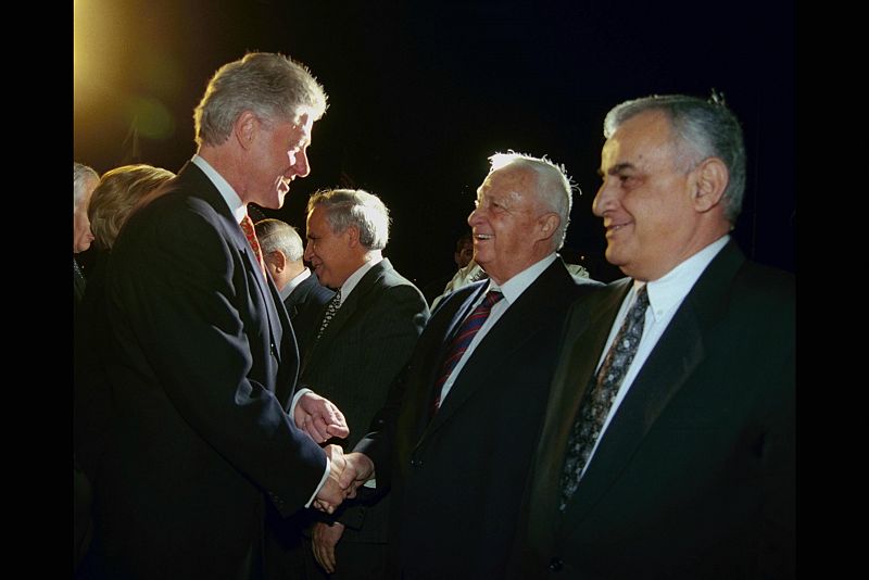 Handout picture of Sharon greeting Clinton near Tel Aviv