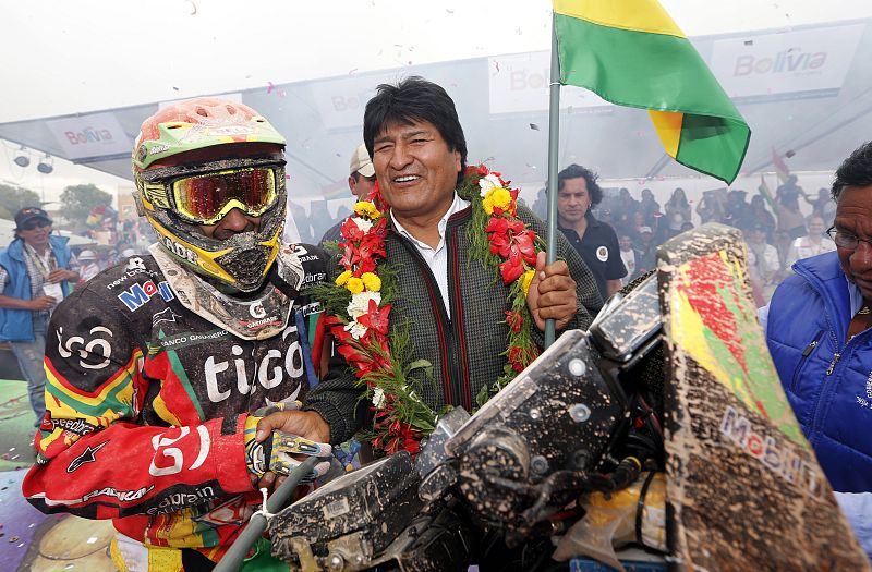 Bolivian President Morales celebrates on the podium with Speedbrain rider Salvatierra of Bolivia at the end of the seventh stage of the Dakar Rally from Salta to Uyuni