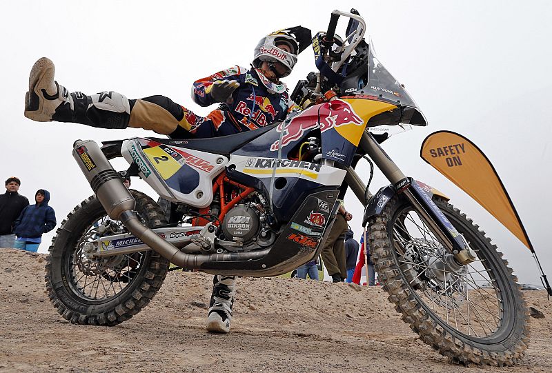Spain's Coma gets on his KTM motorcycle, ready to start the 12th stage of the Dakar Rally 2014, from El Salvador to La Serena