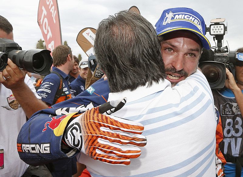 Spain's Viladoms on his KTM motorcycle celebrates with his father after taking second place in the sixth South American edition of the Dakar Rally 2014 in Valparaiso