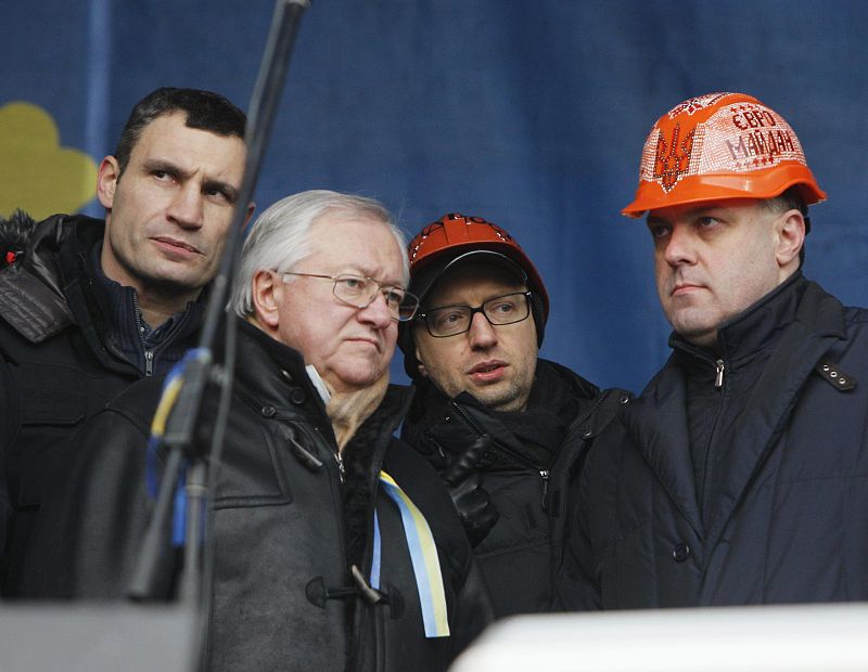 Former Ukrainian Foreign Minister Tarasyuk stands onstage with opposition leaders during a pro-European rally atIndependence Square in Kiev