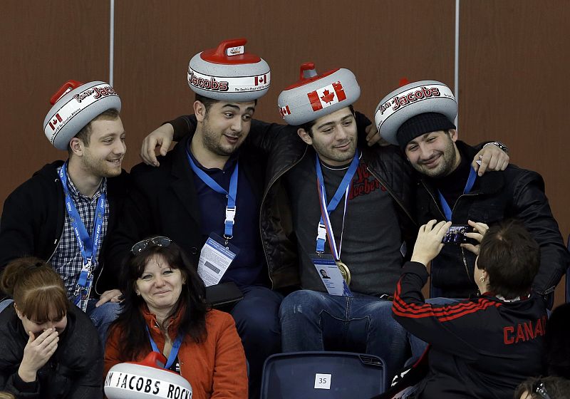 Fans of Canada attend their men's curling round robin game against Norway at the 2014 Sochi Winter Olympics