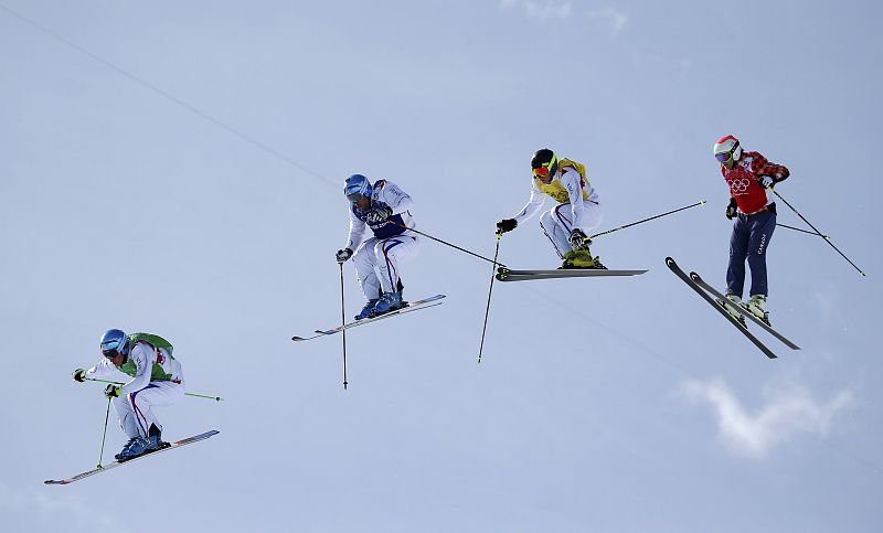 France's Chapuis competes with compatriots Bovolenta and Midol and Canada's Leman during men's freestyle skiing skicross finals round at 2014 Sochi Winter Olympic Games in Rosa Khutor