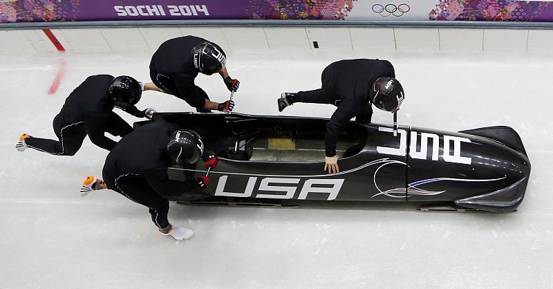 Pilot Holcomb of the U.S. and his teammates start during a four-man bobsleigh training event at the Sanki Sliding Center in Rosa Khutor, during the Sochi 2014 Winter Olympics