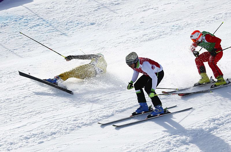 Germany's Eigler crashes as Slovenia's Flisar and Switzerland's Niederer compete during the men's freestyle skiing skicross small final round at the 2014 Sochi Winter Olympic Games in Rosa Khutor