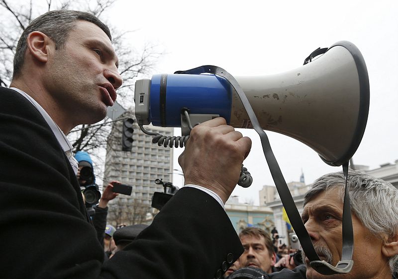 Ukrainian opposition leader and head of the UDAR (Punch) party Vitaly Klitschko addresses anti-government protesters outside the Ukrainian Parliament building in Kiev