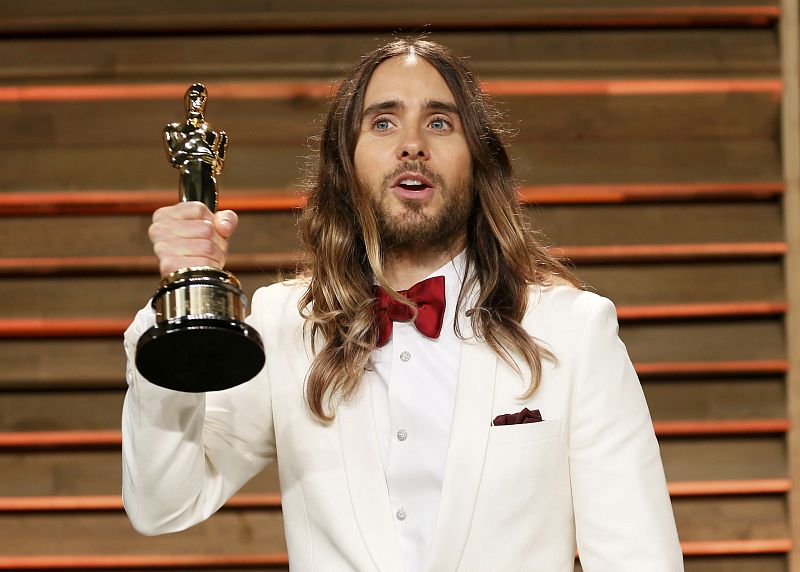 Actor Jared Leto holds his award for best supporting actor as he arrives at the 2014 Vanity Fair Oscars Party in West Hollywood