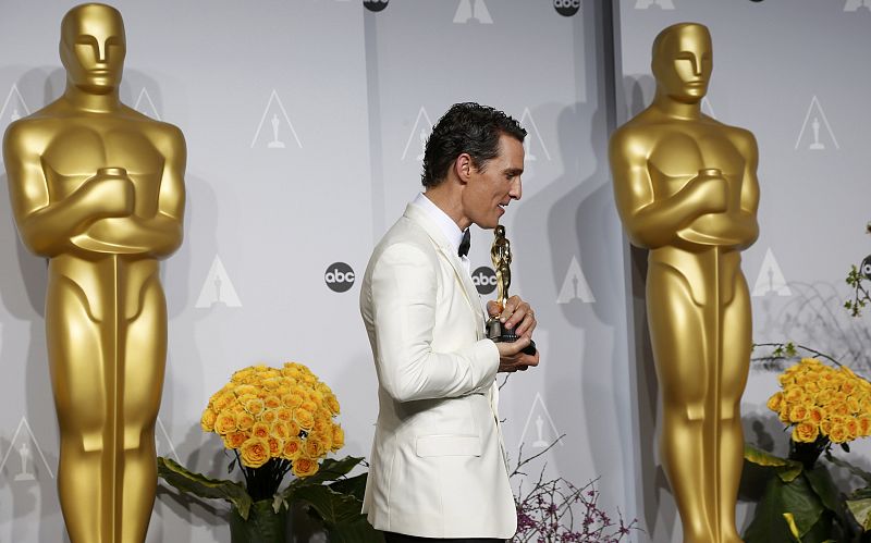 Matthew McConaughey, best actor winner for his role in "Dallas Buyers Club," walks offstage with his Oscar at the 86th Academy Awards in Hollywood