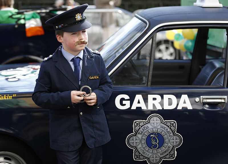 Ciaran, dressed as a member of the Garda, poses for a photograph before the St Patrick's Day parade in central London