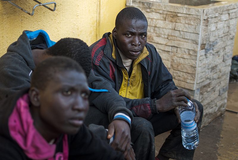 Would-be immigrants gather in the courtyard of a temporary immigrant holding center in Melilla