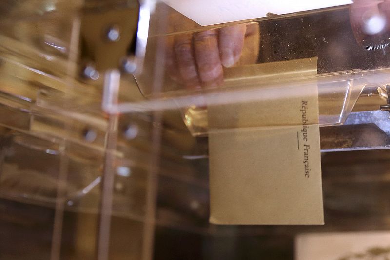 A voter casts a ballot in the European Parliament election in Tulle