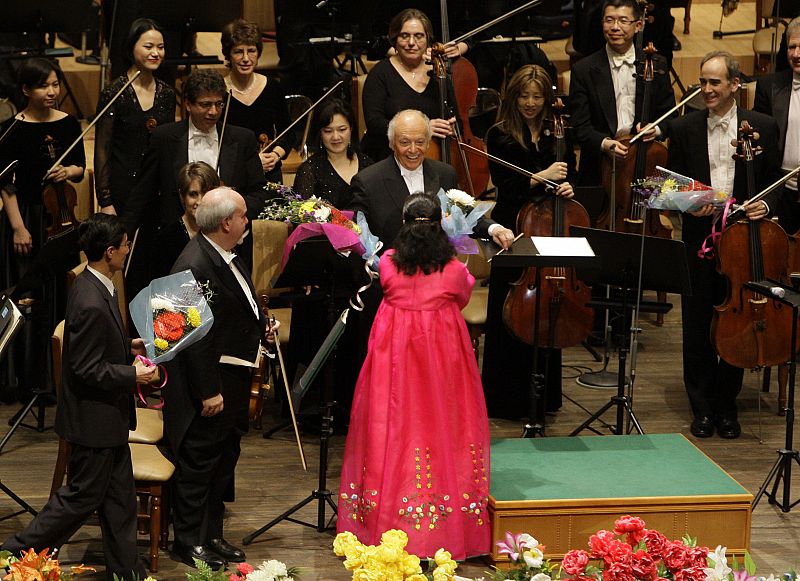 File photo of Music Director Maazel reacting as he is handed flowers after conducting the New York Philharmonic during their concert at the Grand Theatre in the North Korean capital of Pyongyang