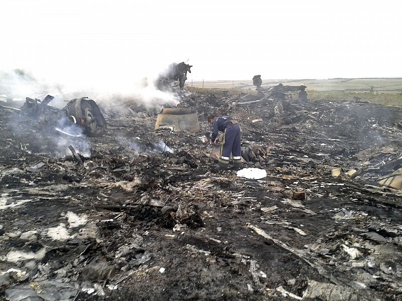 Emergencies Ministry member works at the site of a Malaysia Airlines Boeing 777 plane crash in the settlement of Grabovo in the Donetsk region