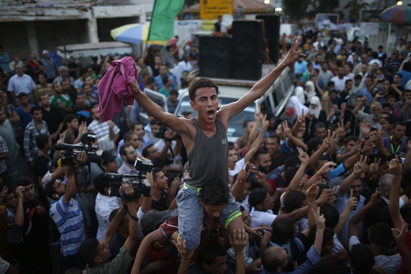 Palestinians celebrate what they said was a victory over Israel following a ceasefire in Gaza City
