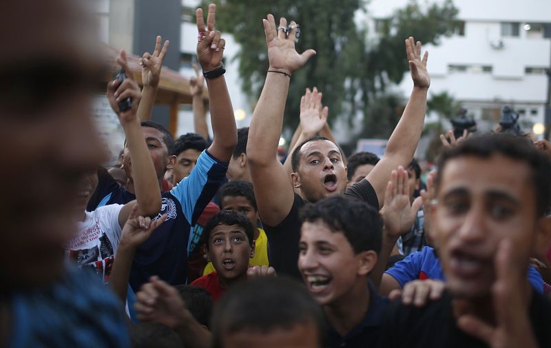 Palestinians celebrate what they said was a victory over Israel, following a ceasefire in Gaza City