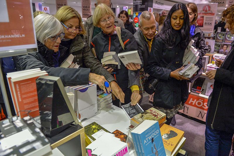 The final copy of French writer Patrick Modiano's book "L'herbe des nuits" is snatched from a table at a bookstore, minutes after Modiano was declared the winner of the 2014 Nobel Prize for Literature, in Stockholm