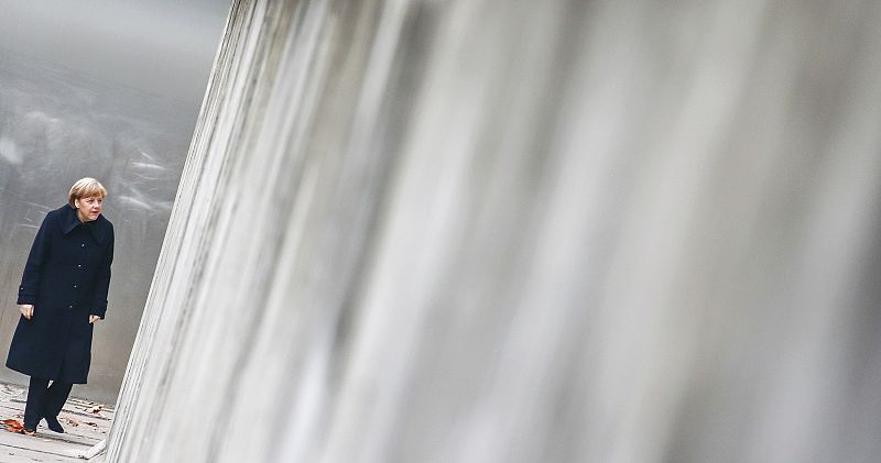 German Chancellor Merkel walks along former Berlin Wall during ceremony marking 25th anniversary of fall of the Wall in Berlin