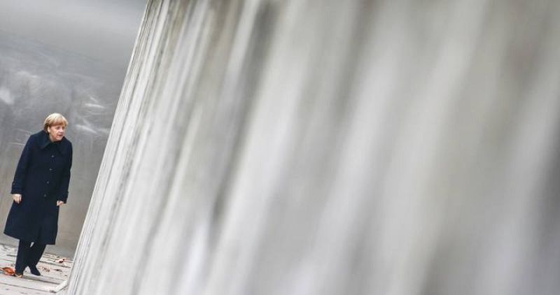 German Chancellor Merkel walks along former Berlin Wall during ceremony marking 25th anniversary of fall of the Wall in Berlin