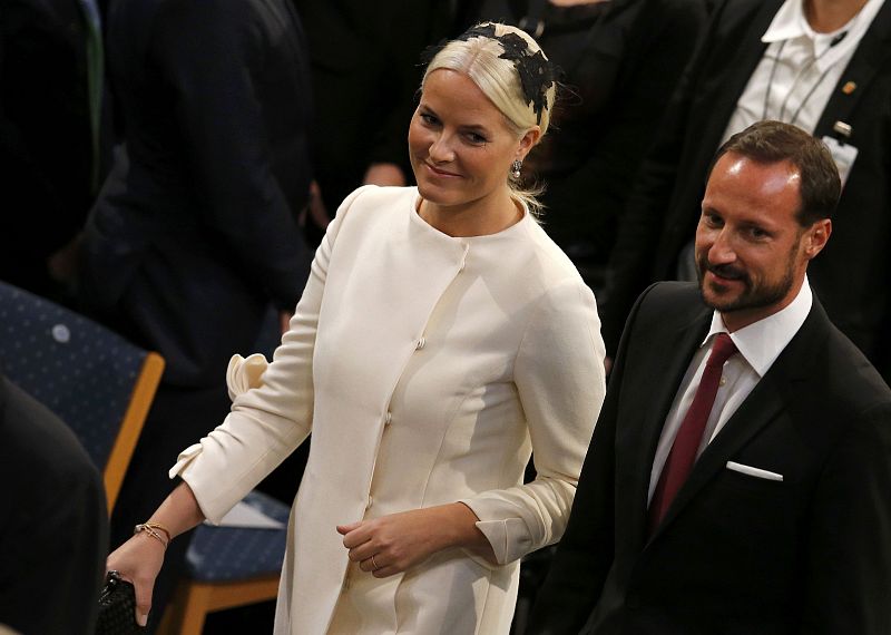 Norway's Crown Princess Mette-Marit and Crown Prince Haakon arrive for the Nobel Peace Prize awards ceremony at the City Hall in Oslo