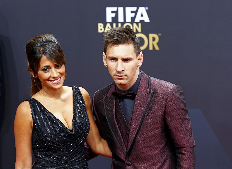 Barcelona's Messi of Argentina, a nominee for the 2014 FIFA World Player of the Year, arrives with partner Roccuzzo for the FIFA Ballon d'Or 2014 soccer awards ceremony in Zurich