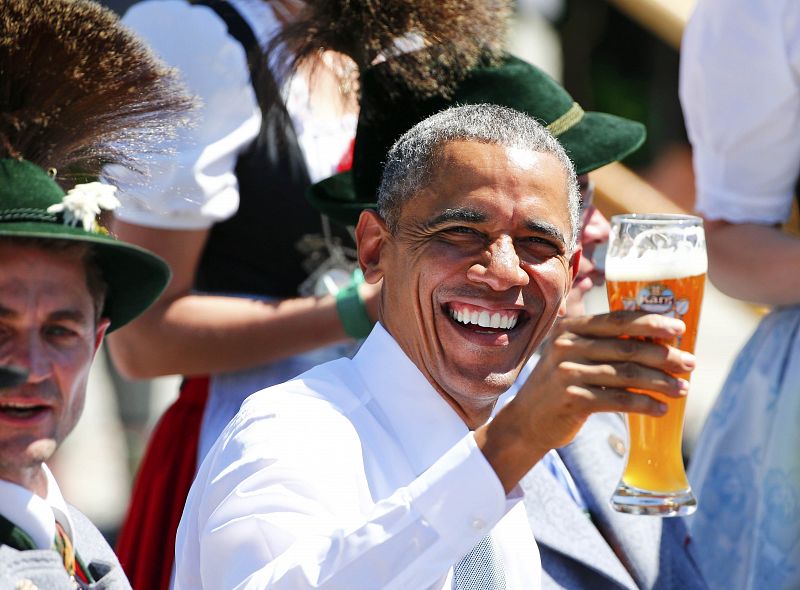 U.S. President Obama toasts with beer as he visits Kruen