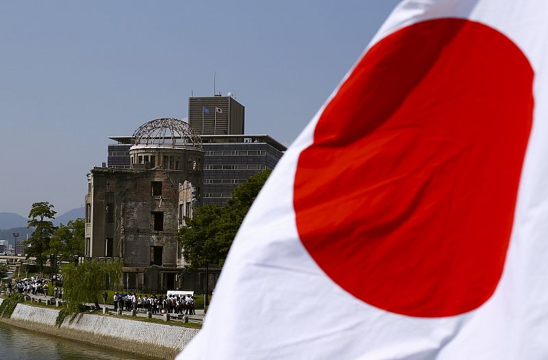 The Japanese national flag is seen near the Atomic Bomb Dome in Hiroshima