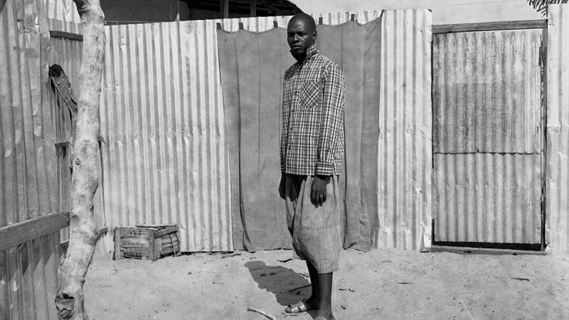 'Man Standing in a Courtyard' (1959-68). Oumar Ka.