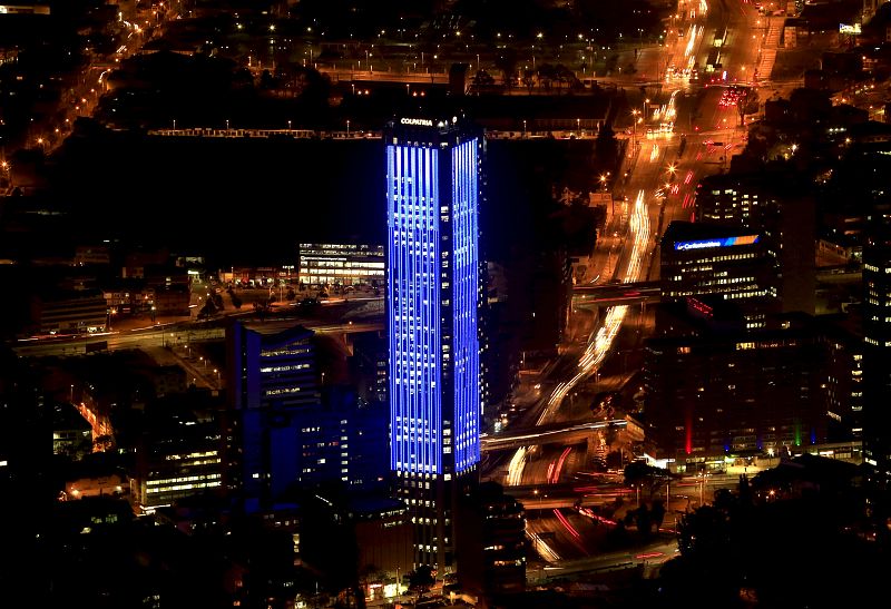 The Colpatria tower is pictured as it is lit up in blue to honor the 70th anniversary of the United Nations in Bogota