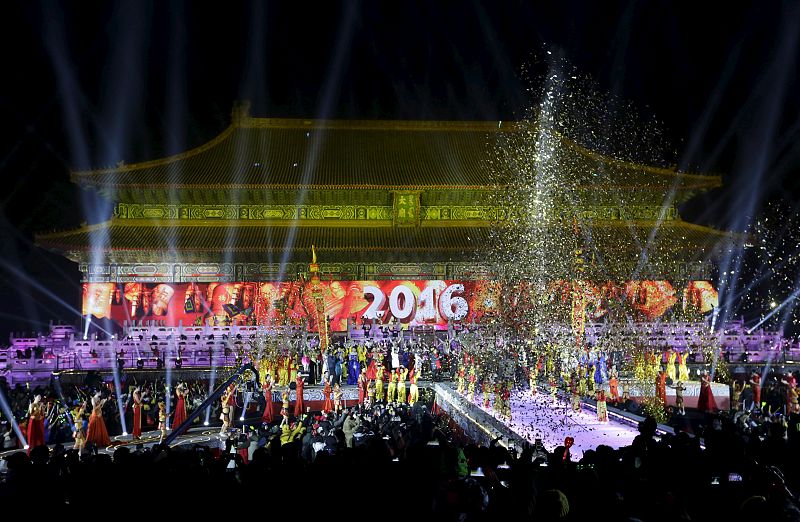 Dancers perform to celebrate the new year during a countdown event at Tai Miao in Beijing
