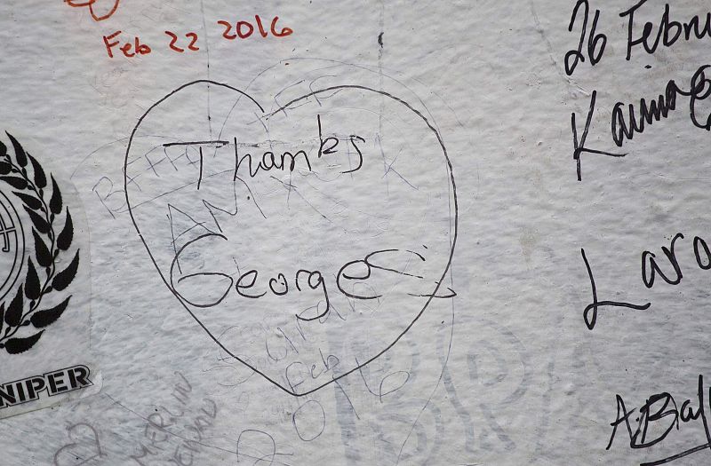 A tribute to music producer George Martin is seen outside the Abbey Road recording studios in London