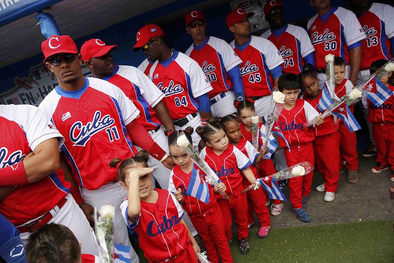 The Cuban National team and mascots line up before playing an exhibition game against the MLB Tampa Bay Rays in Havana