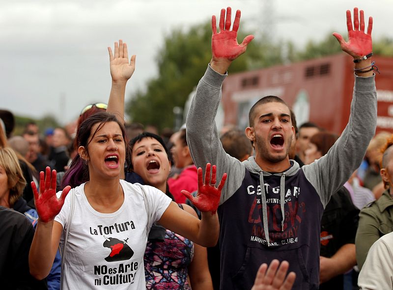 Animal rights activists shout slogans during the Toro de la Pena, formerly known as Toro de la Vega festival, in Tordesillas