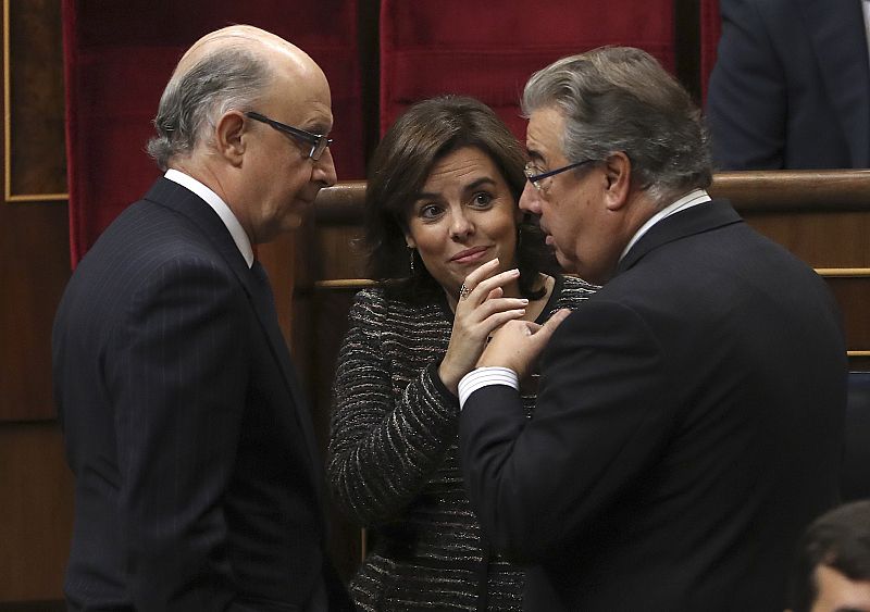 Soraya Sáenz de Santamaría, Cristóbal Montoro, y Juan Ignacio Zoido en el Congreso