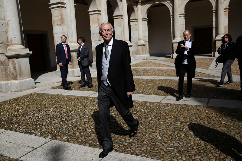 Spanish writer Eduardo Mendoza walks away after posing for the media before a ceremony where Mendoza will receive the "Premio Cervantes" Literature Award at the University of Alcala de Henares