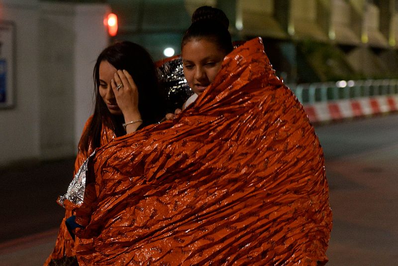 People flee as police attend to an incident near London Bridge in London