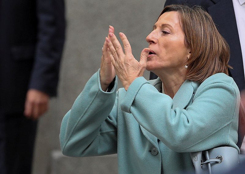 Speaker of Catalan parliament Carme Forcadell blows a kiss as she leaves Spain's Supreme Court after being summoned to testify on charges of rebellion, sedition and misuse of public funds in Madrid