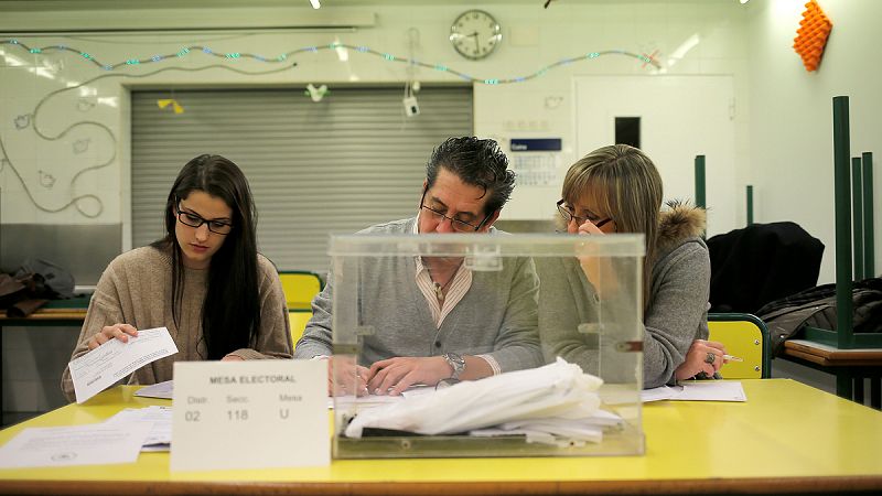 Electoral workers prepare a polling station for Catalonia's regional elections in Barcelona