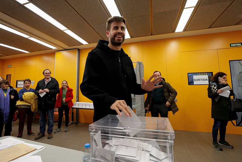 Barcelona's soccer player Pique casts his vote in Catalonia's regional elections at a polling station in Sant Just Desvern
