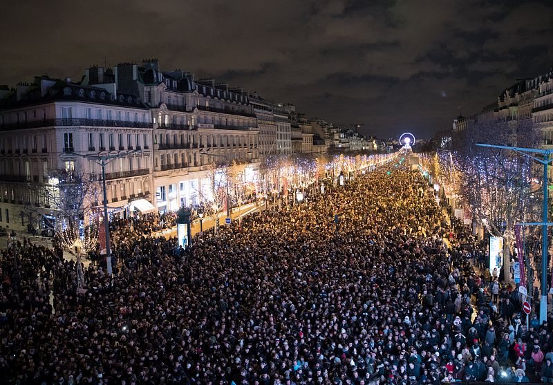 General view of the Champs Elysees Avenue in Paris as revellers take part in New Year celebrations