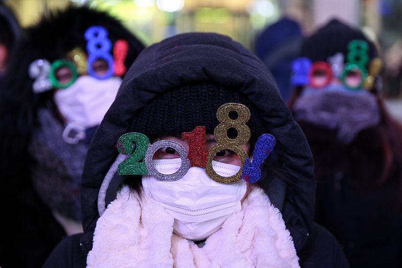 Revelers gather in Times Square ahead of the New Year's Eve celebrations in New York