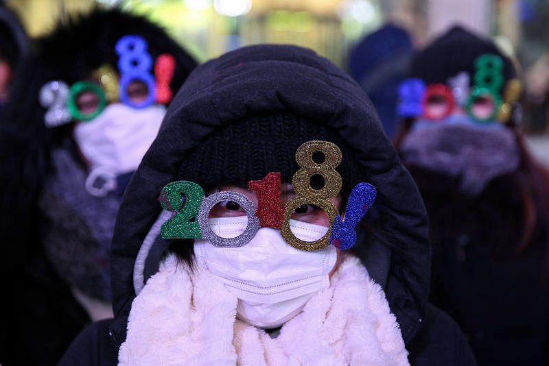 Revelers gather in Times Square ahead of the New Year's Eve celebrations in New York