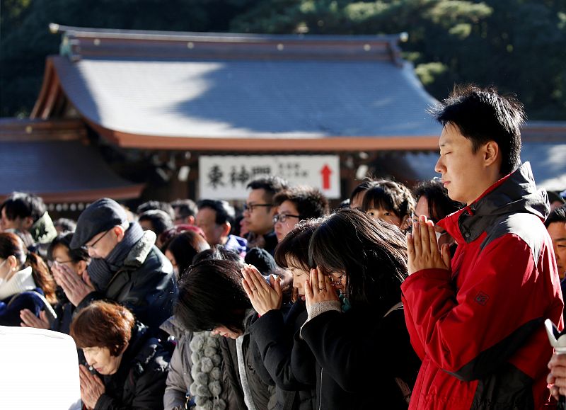 People offer prayers on the first day of the new year at the Meiji Shrine in Tokyo