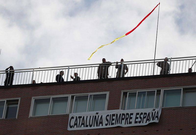 A banner reading "Catalonia Always Spain" hangs during a parade as part of celebrations to mark Spain's National Day in Madrid