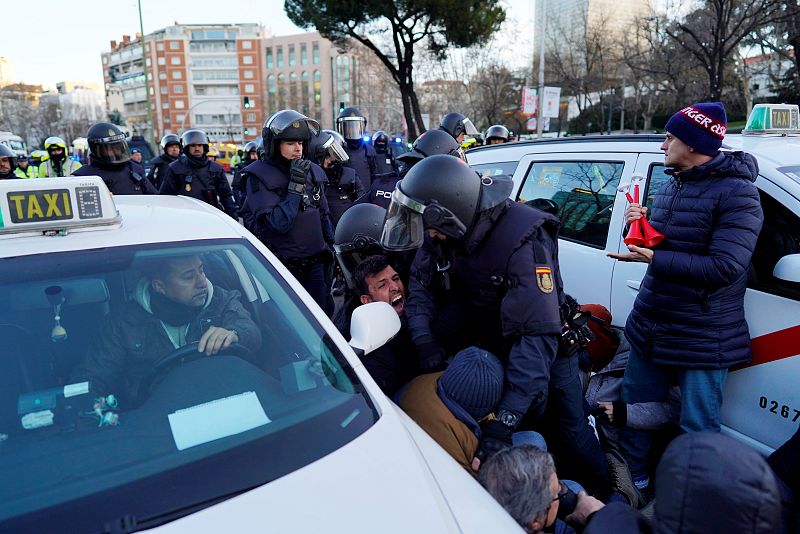 Taxi drivers disrupt traffic to protest against ride-hailing services in central Madrid