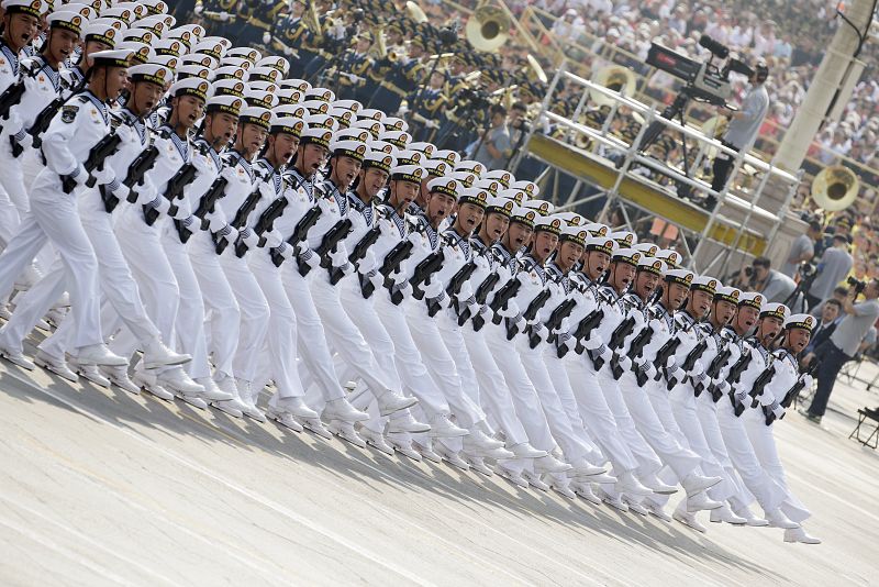 Soldiers of People's Liberation Army (PLA) march in formation past Tiananmen Square during the military parade marking the 70th founding anniversary of People's Republic of China