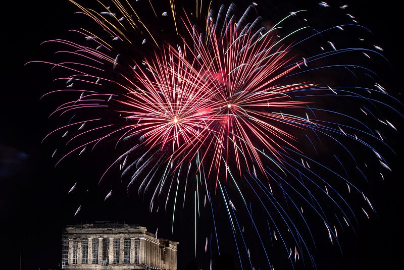 Fireworks explode over the ancient Parthenon temple atop the Acropolis hill during New Year's day celebrations, amid the coronavirus disease (COVID-19) pandemic in Athens