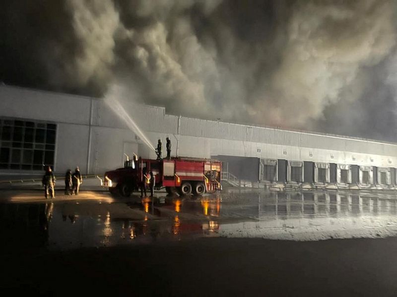 Warehouse storing frozen products is seen on fire after shelling in Kyiv region