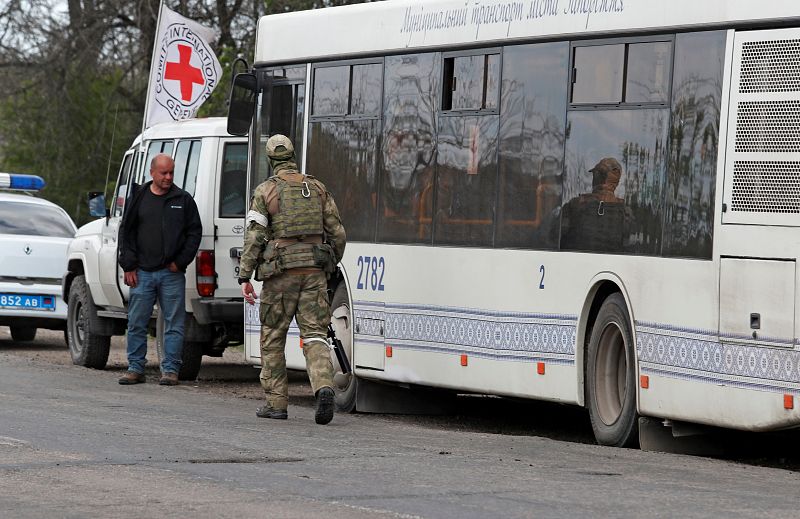 Evacuees from Mariupol travel in a convoy to Zaporizhzhia