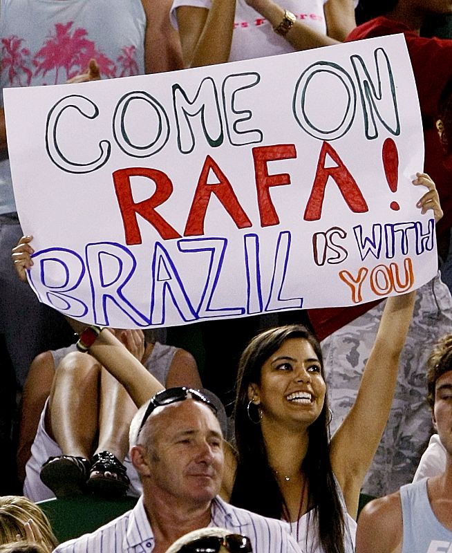 A fan holds up a banner for Spain's Nadal during his men's singles final match against Switzerland's Federer at the Australian Open