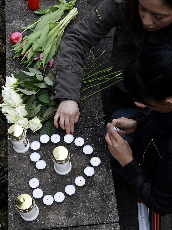 Candles are placed near the Albertville-Realschule school where a shooting incident took place in Winnenden